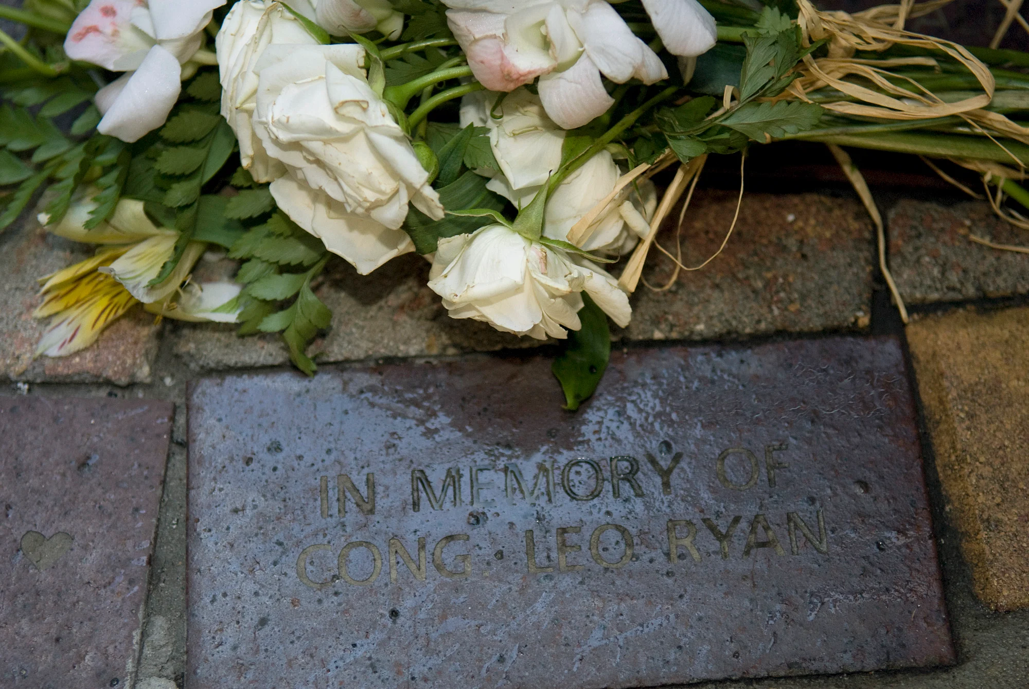 Flowers beside a memorial inscription for Congressman Leo Ryan in Clearwater, Florida, 2008.