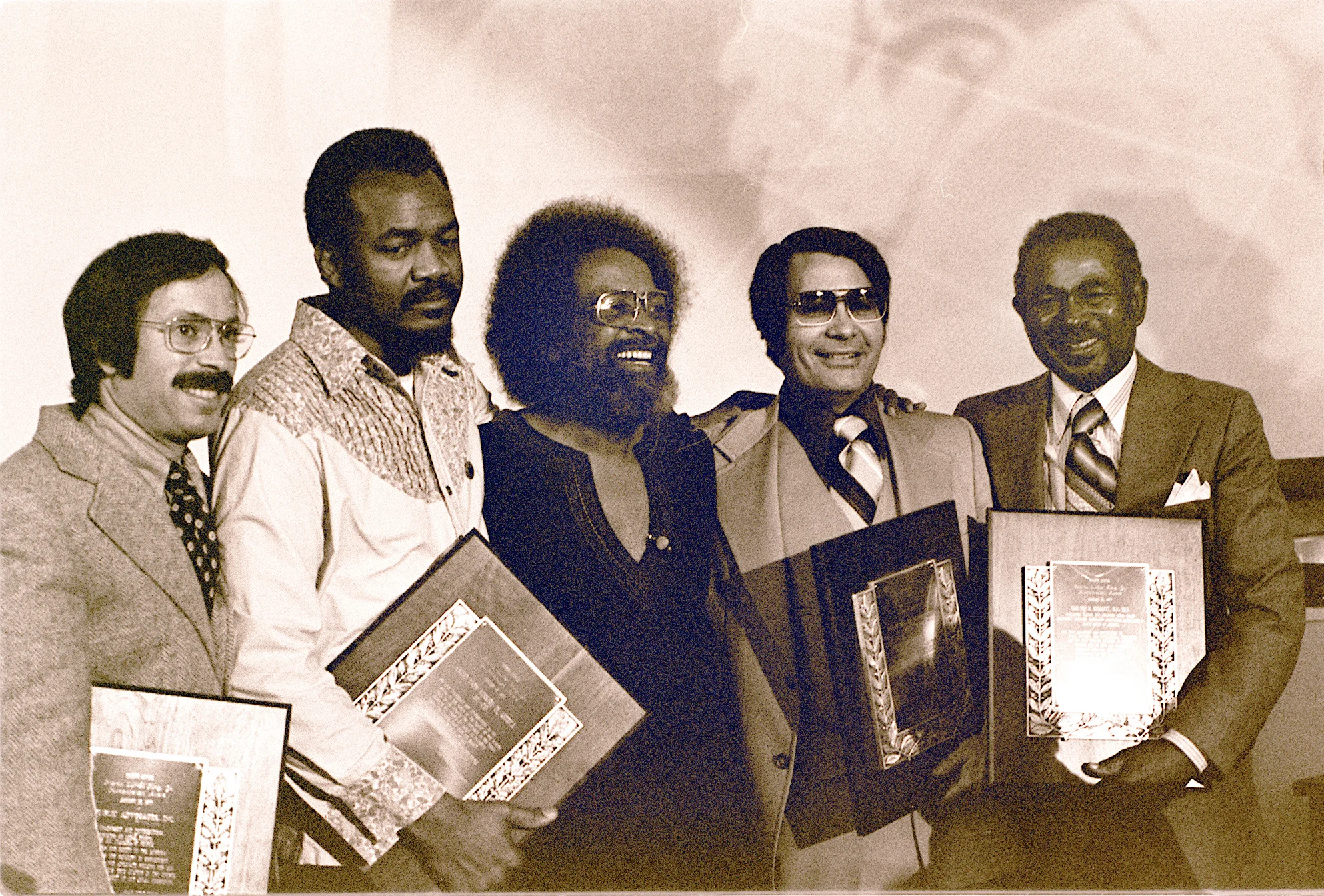 Jim Jones (second from right) receiving an award at Glide Memorial Church in January 1977.